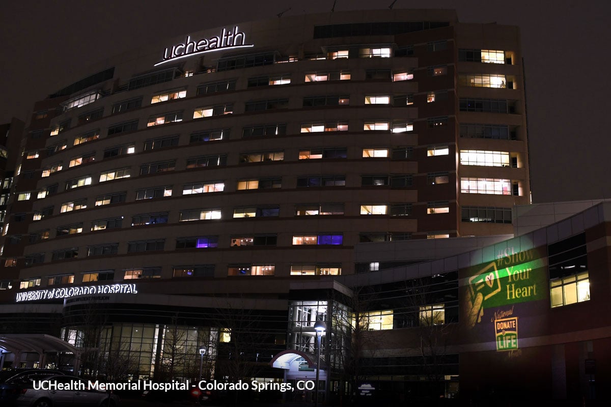 A hospital in Colorado Springs, Colorado projects a "Show Your Heart" logo onto the building.