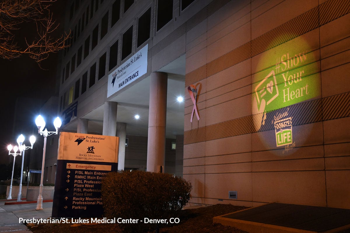 A hospital in Denver, Colorado projects a "Show Your Heart" gobo onto its exterior wall.