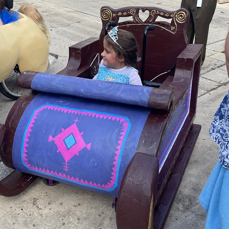 An Elsa's Sleigh adaptive costume for children with disabilities.