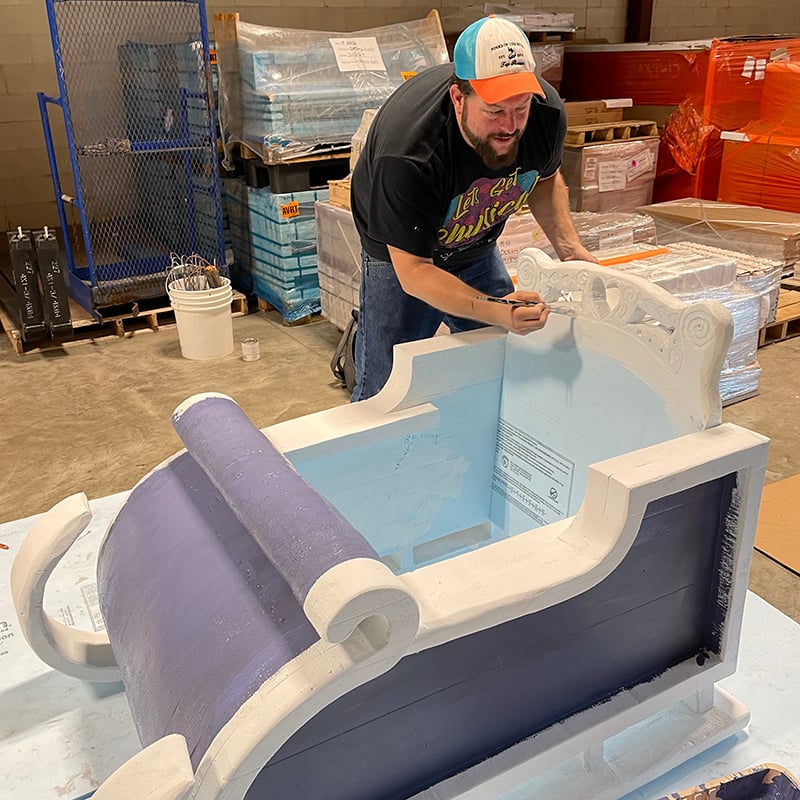 Painting an Elsa's Sleigh adaptive costume for children with disabilities.