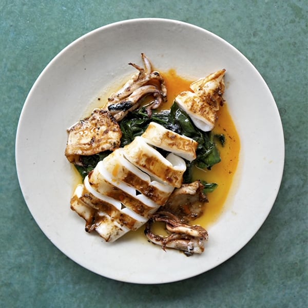 A fish dish on a textured surface that was created with Rosco Supersat Paint for a food photoshoot backdrop.
